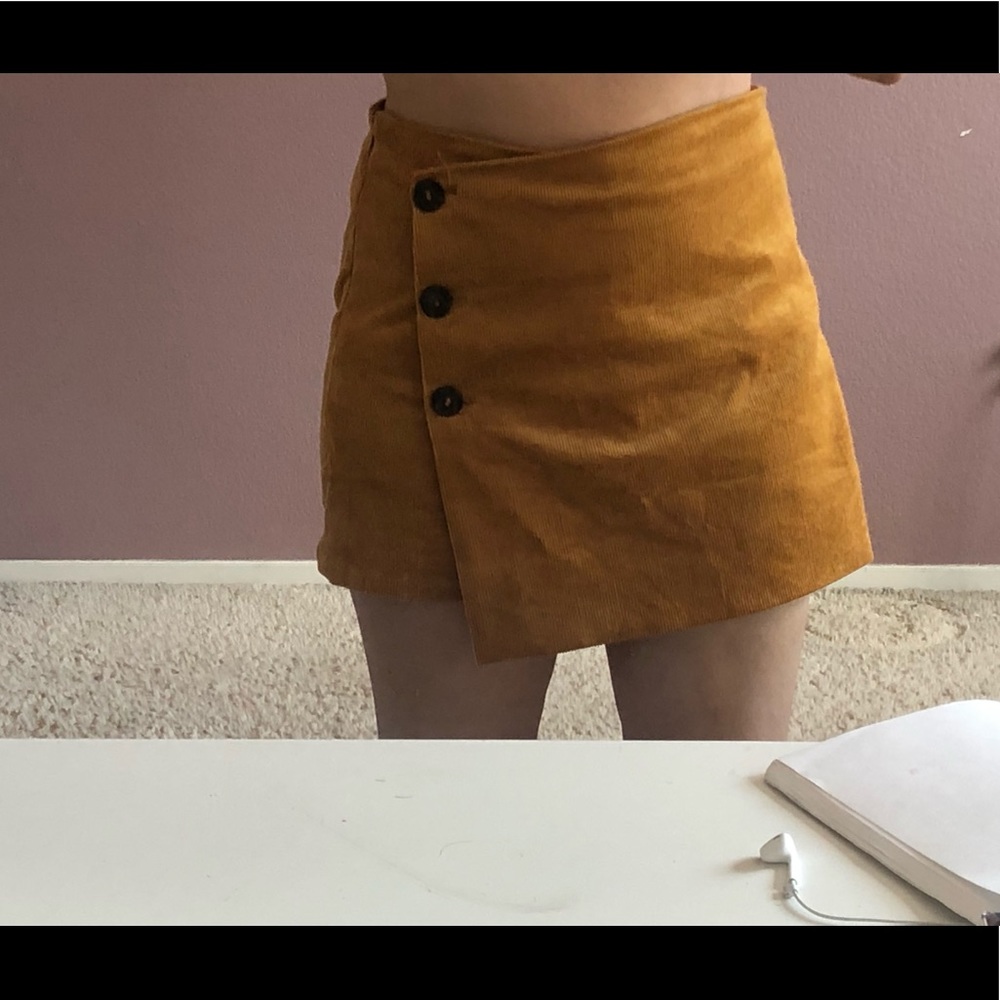 Mustard skirt with shorts connected.